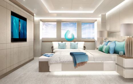 Owner's cabin onboard Heesen Project Aura, central berth faces flatscreen TV, with wide window on far side.