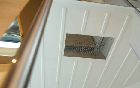 Aquila 45 Sport wet head rainfall shower detail, showing overhead fixture and moulded ceiling design