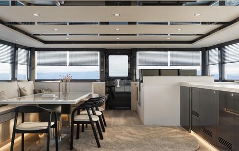Rendering of VisionF 65 Catamaran interior with dining area and galley