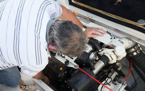 owner operator checking the engine 