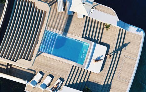 Aerial rendering of superyacht Project Orca beach club with sun loungers and infinity pool