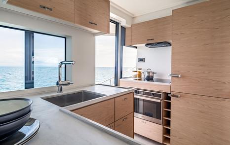 Overview of galley and adjacent windows onboard Beneteau Grand Trawler 63