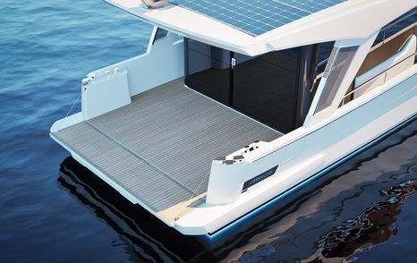 Aft cockpit of motor yacht Greenline 42 with transom lowered to create a swim platform