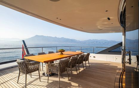 Superyacht Tosun main aft deck with shaded alfresco dining area
