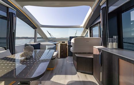 Galeon 570 Sky yacht helm station with open roof 