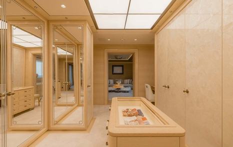 Here Comes The Sun's spacious, neutral walk in wardrobe