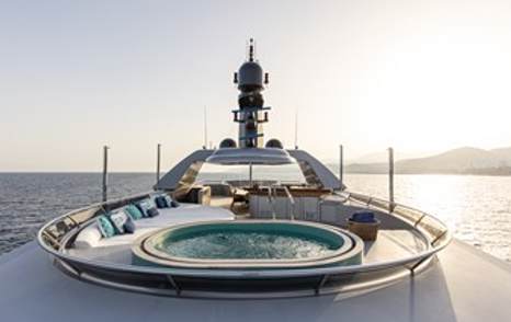 Motor yacht Vibrance's sundeck, surrounded by sunset 