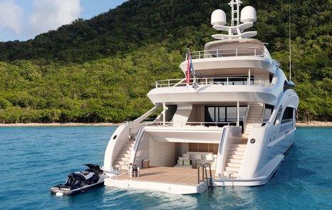 Rear view of Heesen Project Aura superyacht, Jet ski sat alongside, steps visible ascending from swim platform to higher decks