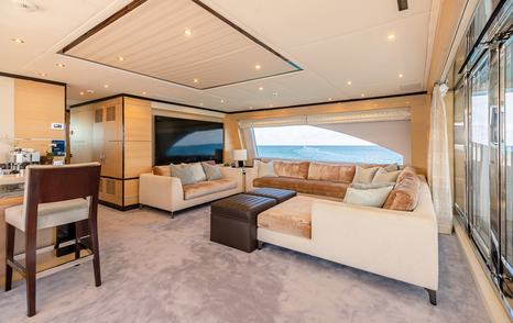 Superyacht Inspiration's main saloon sofa and mounted TV