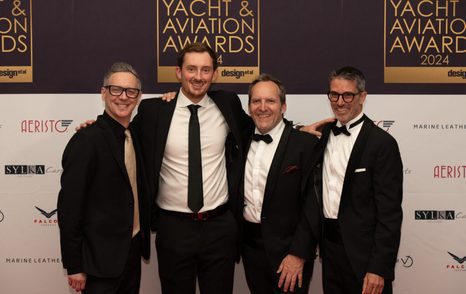 Group of men in tuxedos at the International Yacht and Aviation Awards