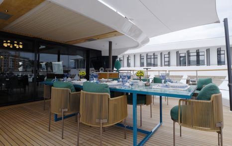 Sirena 118 bridge deck dining table with bespoke tiled finish