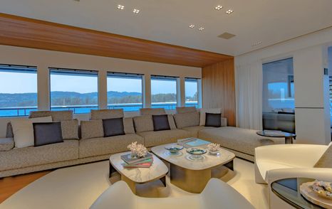 Catamaran SpaceCat's main saloon with cream L-shaped sofa 