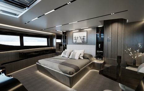 Pearl 82 master cabin, central berth facing forward with wide glazing on portside and seating area starboard.