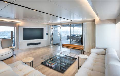 Numarine 40MXP explorer yacht main saloon L-shaped seating area and mounted TV 