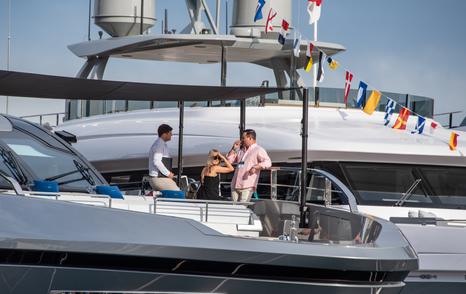 charter brokers on deck of superyacht