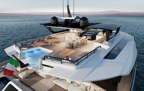 Aft view of Extra Yachts VILLA X30 flybridge, infinity pool in foreground with alfresco dining option and lounge area set back.