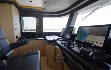 Helm chair, controls and navigation displays aboard the Gulf Craft Majesty 100 Terrace