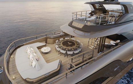 Superyacht RAJA² aft deck with white sunpad and circular dining area 