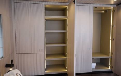 Manda S07 Berlinetta owner cabin wardrobe storage with illuminated hanging space and shelving