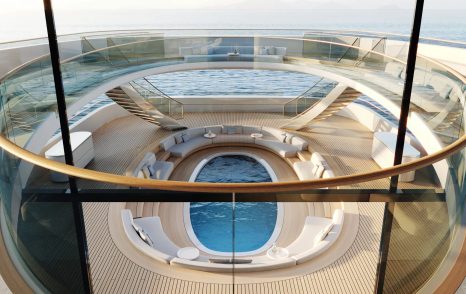 Elevated view onboard Feadship PURE, lookinf down through decks to swimming pool below.