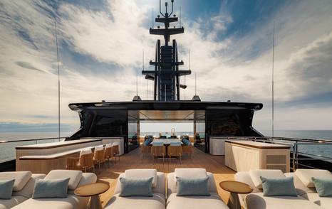 Sanlorenzo 74Steel superyacht Silver Fox upper deck with shaded alfresco dining and sunpads 