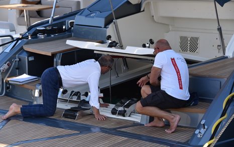 people looking at the yacht engine