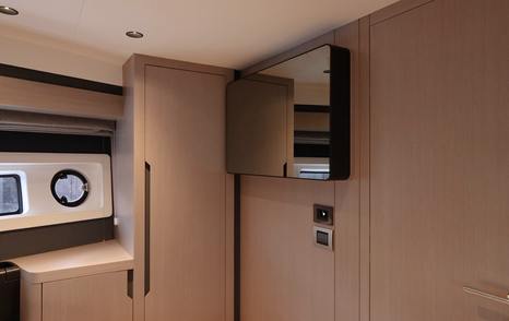 Sirena 48 VIP cabin storage with mirrored television surround