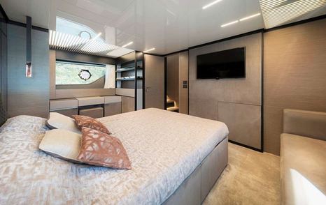 Motor Yacht Cloud Nine owner's room with mounted TV