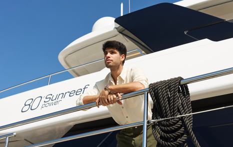 Tennis player Carlos Alcaraz leaning on walk-around of 80 Sunreef power catamaran