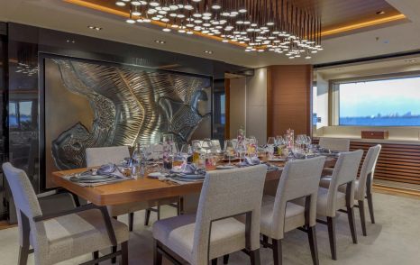 Superyacht Atomic's main saloon dining area