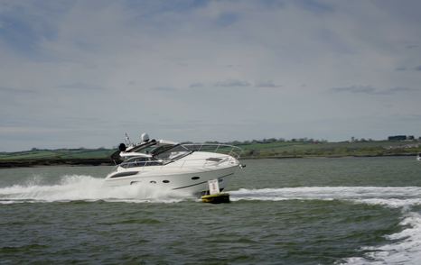 Princess V39 racing past a marker buoy on the River Crouch during the YachtBuyer Prop Gear challenge.