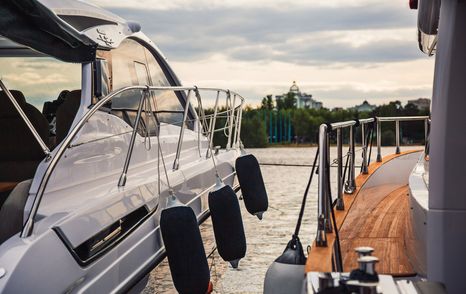 well placed fenders on small motor cruiser yacht