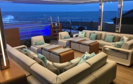 Superyacht Utopia IV L-shaped aft sofas with swimming pool