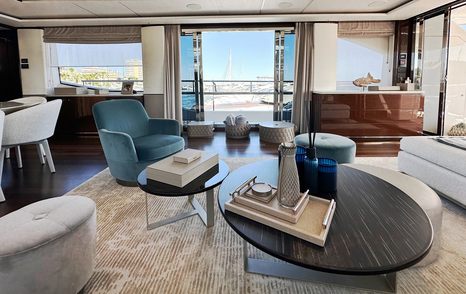 Motor yacht Ghost's main saloon with glass sliding doors 