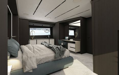 Pershing GTX116 master cabin, central berth facing starboard with small window in background.