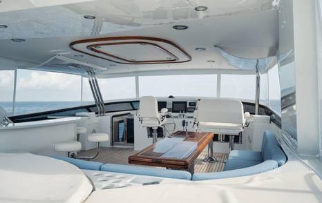 Motor yacht Island Girl's flybridge with curved seating 