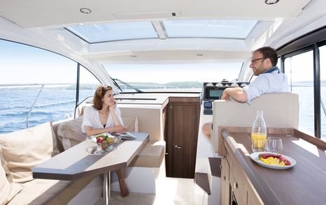 people relaxing in a deck salon wheelhouse 