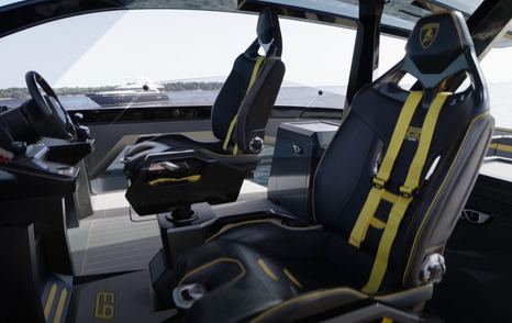 The Tecnomar Lamborghini 63 helm seats features black and yellow detailing, in addition to bright yellow racing harnesses for additional safety