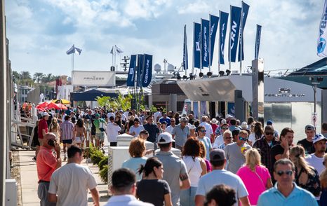 Visitors to FLIBS walking the docks in front of exhibitors