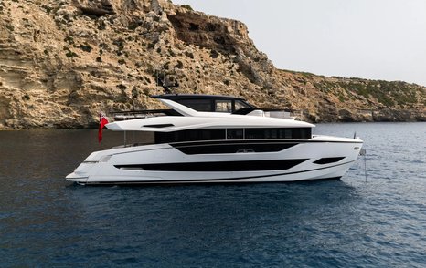 Sunseeker 82 Ocean Enclosed motor yacht at anchor 