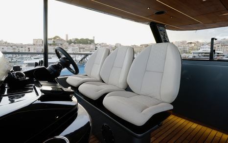 Sunreef Ultima 88 helm console with wide in-house display and steering wheel