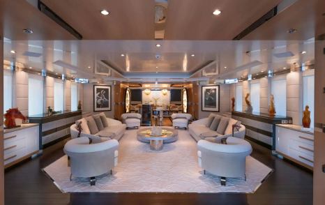 Abeking & Rasmussen Superyacht Scott Free main saloon with white furniture and abstract art