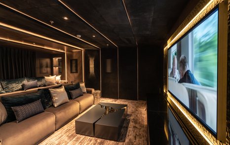 Comfortable seating and cinema screen on superyacht TATIANA