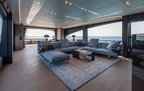 AB Yachts AB 100 motor yacht main saloon with grey U-shaped sofa