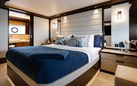 Cabin onboard Sirena Yachts 88, central berth with ensuite on far side.