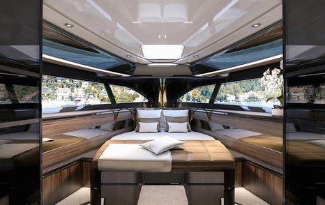 camel-coloured upholstery and white ceiling inside the Libertas 15m 