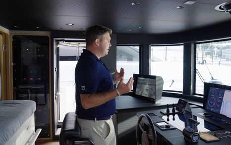 Custom Line Navetta 38 bridge helm with central control pod, navigation screens