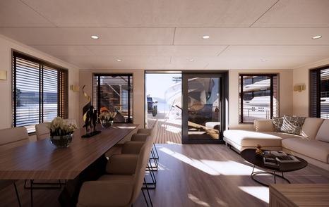Damen yachting support yacht YS 53 interior with dining area and L-shaped sofa