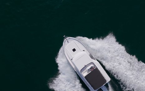 Beneteau Swift Trawler 37 Fly showing broad flared bow underway