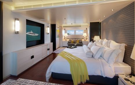 Superyacht Eternity's bedroom with mounted TV 